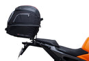 Image showing a Ventura EVO-12 Bike-Pack Kit for KTM 990 Duke (24 - >) with three components: EVO-12 pack bag, Evo-Rack mounted on the motorcycle, and L-brackets with screws. Generic image shown.