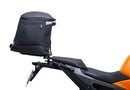 Image showing a Ventura EVO-12 Bike-Pack Kit for KTM 990 Duke (24 - >) with three components: EVO-12 pack bag, Evo-Rack mounted on the motorcycle, and L-brackets with screws. Generic image shown.
