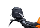 Image showing a Ventura EVO-12 Bike-Pack Kit for KTM 990 Duke (24 - >) with three components: EVO-12 pack bag, Evo-Rack mounted on the motorcycle, and L-brackets with screws. Generic image shown.