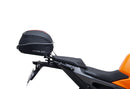 Image showing a Ventura EVO-12 Bike-Pack Kit for KTM 990 Duke (24 - >) with three components: EVO-12 pack bag, Evo-Rack mounted on the motorcycle, and L-brackets with screws. Generic image shown.