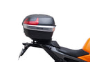 Image showing a Ventura EVO-12 Bike-Pack Kit for KTM 990 Duke (24 - >) with three components: EVO-12 pack bag, Evo-Rack mounted on the motorcycle, and L-brackets with screws. Generic image shown.