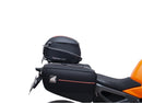 Image showing a Ventura EVO-12 Bike-Pack Kit for KTM 990 Duke (24 - >) with three components: EVO-12 pack bag, Evo-Rack mounted on the motorcycle, and L-brackets with screws. Generic image shown.