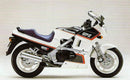 Image of a Ventura EVO-12 Bike-Pack Kit with a black bike pack, "VersaRac" branded bike rack, and L-brackets with screws. Features the adjustable Pack-Rack labeled "EVO-12 Pack" and the versatile "Evo-Rack," designed for Kawasaki GPX 600 R.