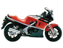 Image of EVO-12 Bike-Pack Kit components: a sleek black Ventura EVO-12 pack, an Evo-Rack mounted on a Kawasaki GPZ 600 R as a Top-Box Rack, and an L-bracket with screws labeled as a generic image.
