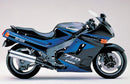 Collage of Kawasaki ZZR 1100 components by Ventura, featuring a black EVO-12 bike pack with an orange "EVO-12 PACK" label, a versatile Top-Box Rack, an "Evo-Rack," and labeled L-bracket and screws: "L-BRACKET Generic Image.