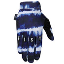 The FIST LEAKY PEN GLOVE is a blue and white tie-dye motocross glove featuring "FIST" in white across the fingers, a black palm, and adjustable wrist strap—ideal MTB gloves for style and performance.