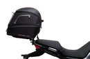 The Ventura EVO-12 Bike-Pack Kit for Moto Guzzi V100, V100S Mandello (22 - >) includes a black EVO-12 pack, a black Evo-Rack or Adjustable Pack-Rack mounted on the motorcycle, and an image of a labeled L-bracket with hardware.