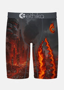 Ethika men's boxer briefs featuring a dramatic graphic print of a burning cityscape with orange flames, dark smoke, and glowing embers, set against a light gray background.