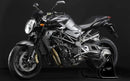 Image showcasing Ventura EVO-12 Bike-Pack Kit components: a black bike-pack with zipper and red detail, an Evo-Rack labeled bike rack, and an L-bracket with screws. Neatly arranged against a white background, highlighting the versatile Top-Box Rack for MV Agusta 920 Brutale (2012).