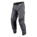 The Troy Lee Designs GP Pant Mono Gray | Youth features black and gray lightweight race pants with reinforced knees, breathable fabric, mesh panels, and a white "Troy Lee Designs" logo on the right leg, shown on a white background.