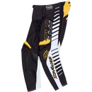 The Troy Lee Designs GP PRO PANT FIFTY-50 BLACK / GOLD features black, white, and yellow graphic stripes, reinforced knee panels, "TLD" and "Troy Lee" branding, plus "TLD Racing" text along the leg. Pants are displayed flat on a white background.