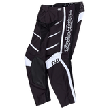 Troy Lee Designs GP PRO PANT SPUN BLACK motocross pants feature black and white geometric patterns, "Troy Lee Designs" lettering on the side, reinforced knee panels, and a streamlined race fit for top performance.