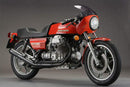 Image of a Ventura EVO-12 Bike-Pack Kit featuring a sleek black Moto Guzzi 850 T, T3 Le Mans bike-pack with an orange stripe. It includes the versatile Evo-Rack and dynamic L-Bracket with screws, each component meticulously labeled for easy identification.