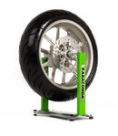 A motorcycle wheel is mounted on a Rabaconda - Motorcycle Wheel Balancer by Rabaconda, set against a white background. The balancer securely holds the wheel upright for balancing, maintenance, or tire changes.