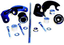 Close-up of an Oggy Knobbs Triumph Frame Slider on a blue and white bike, featuring a black protective slider with circular text at the end, mounted near the engine for fall protection.