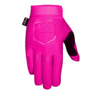 The FIST PINK STOCKER GLOVE is a bright pink motocross/MTB glove with "FIST" across the knuckles, a fist logo on the back, a black thumb patch, and a small black "FIST" tag near the wrist.