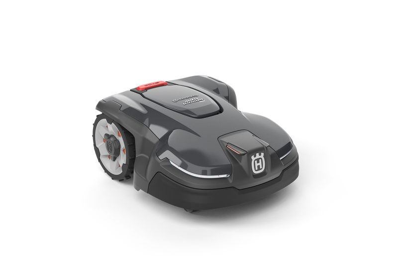 The Husqvarna Automower® 405X is a sleek, modern robotic lawn mower in dark gray with white and red accents and a front Husqvarna logo. Features like Automower Zone Control make yard maintenance effortless. Shown on a transparent background.