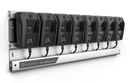 A Husqvarna 40-C80 Charging Station is wall-mounted, holding and charging eight identical black 36V battery chargers neatly arranged in a row.