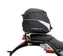 Image displaying Ventura's EVO-12 Bike-Pack Kit for the Royal Enfield Himalayan 410 (17->) includes a black Adjustable Pack-Rack, a metal Evo-Rack mounted on a bike, and an L-Bracket with screws.