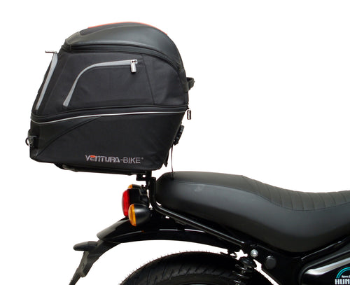 The Ventura EVO-12 Bike-Pack Kit for the Royal Enfield Hunter 350 (22 ->) includes a black soft-sided pack, an Adjustable Pack-Rack with mounting points, and an L-Bracket with screws and assembly parts.