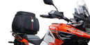 Ventura's EVO-12 Bike-Pack Kit image features a striking black EVO-12 pack with vibrant orange accents, an EVO-Rack gracefully fitted on a Suzuki DL 1050 V-Strom XT bike, and an L-Bracket with screws. The Adjustable Pack-Rack is designed to enhance your biking experience.