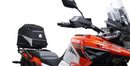 Ventura's EVO-12 Bike-Pack Kit image features a striking black EVO-12 pack with vibrant orange accents, an EVO-Rack gracefully fitted on a Suzuki DL 1050 V-Strom XT bike, and an L-Bracket with screws. The Adjustable Pack-Rack is designed to enhance your biking experience.