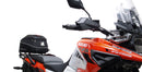 Ventura's EVO-12 Bike-Pack Kit image features a striking black EVO-12 pack with vibrant orange accents, an EVO-Rack gracefully fitted on a Suzuki DL 1050 V-Strom XT bike, and an L-Bracket with screws. The Adjustable Pack-Rack is designed to enhance your biking experience.