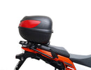 Ventura's EVO-12 Bike-Pack Kit image features a striking black EVO-12 pack with vibrant orange accents, an EVO-Rack gracefully fitted on a Suzuki DL 1050 V-Strom XT bike, and an L-Bracket with screws. The Adjustable Pack-Rack is designed to enhance your biking experience.