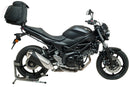 Image showing the Ventura EVO-12 Bike-Pack Kit for Suzuki SV 650X (16 - >), featuring an EVO-12 pack bag, Evo-Rack Top-Box Rack mounted on the bike, and a generic L-Bracket with screws displayed on a white background.