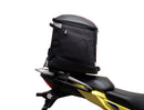 Image showing components of the Ventura EVO-12 Bike-Pack Kit for Suzuki V-Strom 250SX (23->): a black EVO-12 pack, Evo-Rack Adjustable Pack-Rack on a motorcycle, and labeled L-brackets with screws. Each item is individually labeled.