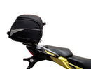 Image showing components of the Ventura EVO-12 Bike-Pack Kit for Suzuki V-Strom 250SX (23->): a black EVO-12 pack, Evo-Rack Adjustable Pack-Rack on a motorcycle, and labeled L-brackets with screws. Each item is individually labeled.