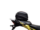 Image showing components of the Ventura EVO-12 Bike-Pack Kit for Suzuki V-Strom 250SX (23->): a black EVO-12 pack, Evo-Rack Adjustable Pack-Rack on a motorcycle, and labeled L-brackets with screws. Each item is individually labeled.