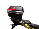 Image showing components of the Ventura EVO-12 Bike-Pack Kit for Suzuki V-Strom 250SX (23->): a black EVO-12 pack, Evo-Rack Adjustable Pack-Rack on a motorcycle, and labeled L-brackets with screws. Each item is individually labeled.