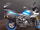 Image showing the Ventura EVO-12 Bike-Pack Kit for Suzuki GSX-S 1000 GX/GX+ (24->), with a black EVO-12 pack, Evo-Rack Top-Box Rack mounted on the motorcycle, and generic L-bracket kit with metal bars and screws, all clearly labeled.