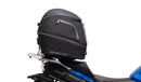 Image showing the Ventura EVO-12 Bike-Pack Kit for Suzuki GSX-S 1000 GX/GX+ (24->), with a black EVO-12 pack, Evo-Rack Top-Box Rack mounted on the motorcycle, and generic L-bracket kit with metal bars and screws, all clearly labeled.