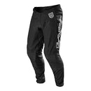 The Troy Lee Designs SE PRO PANT SOLO BLACK motocross gear features a white logo and small waist patch, made from lightweight, durable material, and is shown against a plain white background.