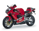 Image showcasing the EVO-12 Bike-Pack Kit components. Top left: Black EVO-12 pack with an orange stripe. Top right: Ventura Evo-Rack sport-rack attached to an Aprilia RSV Mille (98-99) motorcycle. Bottom: L-Bracket with screws labeled "Generic Image.