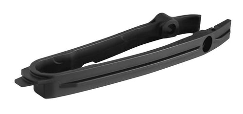The black RTECH chain slider for Husqvarna TC, FC, TX, FX 23-24 and KTM SX, SX-F, XC, XC-F 23-24 features a curved design with intricate grooves and ridges. Its matte finish indicates precision engineering for mechanical or automotive uses.
