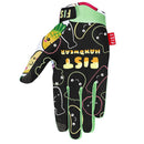 The FIST INDY CARMODY - SWEET TREATS GLOVE features playful cartoon fruits and veggies with smiling faces on a white background, green cuffs, and black thumb material—perfect for adding fun to any MTB ride.