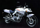 Ventura's EVO-12 Bike-Pack Kit for Suzuki GSX 750 SX/SZ Katana includes a black EVO-12 pack, a black Evo-Rack mounted on the motorcycle, and an L-Bracket with screws, as shown in a generic image.
