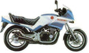 Ventura EVO-12 Bike-Pack Kit for Suzuki GSX 550 ESD (83-86) shown with a black bike-pack, Evo-Rack with grab-handle on a motorcycle, and labeled L-bracket with screws. All items are displayed separately in the image.