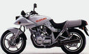 The Ventura EVO-12 Bike-Pack Kit for Suzuki GSX 750 SE, SF Katana includes a black bike pack, Adjustable Pack-Rack Evo-Rack mounted on the motorcycle, and an L-bracket with hardware—all labeled with product names.
