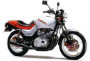 The Ventura EVO-12 Bike-Pack Kit for Suzuki GS 650 GX Katana includes a black EVO-12 pack, an Evo-Rack Top-Box Rack mounted on the bike, plus labeled L-brackets with screws; all components are displayed separately.