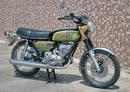 A generic image displays Ventura products for the Suzuki GT 250 K, L: a black EVO-12 Pack, an Evo-Rack rear bike rack mounted on a motorcycle, and an L-Bracket with hardware. Each is clearly labeled in the photo.