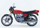 The EVO-12 Bike-Pack Kit for the Ventura Suzuki RG 250 WD includes a black EVO-12 pack, an Evo-Rack Top-Box Rack mounted on the motorcycle, and a generic image of a black L-bracket with screws.