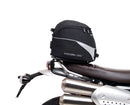 Image shows a Ventura EVO-12 bike-pack kit for Triumph Scrambler 1200 XE, XC (19->), featuring a black zippered pack, Evo-Rack Top-Box Rack on the bike, and L-Bracket with hardware (generic image shown).
