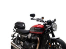 Image shows three labeled Ventura items for the Triumph Speed Twin 1200 (19->): an EVO-12 Pack (compact black bag), Evo-Rack adjustable rack mounted on the motorcycle, and a generic L-Bracket with bolts.