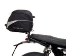 Image shows three labeled Ventura items for the Triumph Speed Twin 1200 (19->): an EVO-12 Pack (compact black bag), Evo-Rack adjustable rack mounted on the motorcycle, and a generic L-Bracket with bolts.