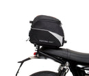 Image shows three labeled Ventura items for the Triumph Speed Twin 1200 (19->): an EVO-12 Pack (compact black bag), Evo-Rack adjustable rack mounted on the motorcycle, and a generic L-Bracket with bolts.