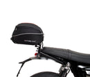 Image shows three labeled Ventura items for the Triumph Speed Twin 1200 (19->): an EVO-12 Pack (compact black bag), Evo-Rack adjustable rack mounted on the motorcycle, and a generic L-Bracket with bolts.